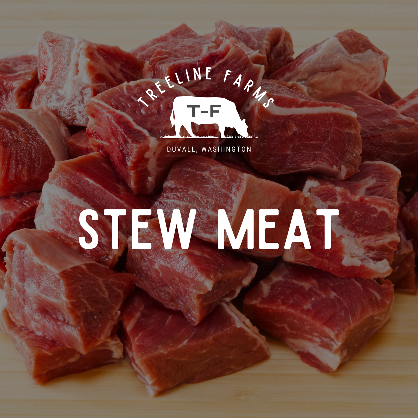 Hand cut beef stew meat on a wood cutting board, with Treeline Farms logo in white.